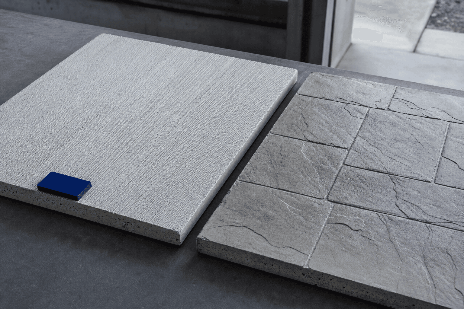 Broom-finished and stamped concrete sample panels shown side by side